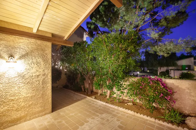 a view of a patio with swimming pool