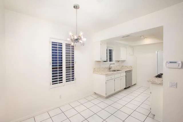 a bathroom with a sink a vanity and a mirror