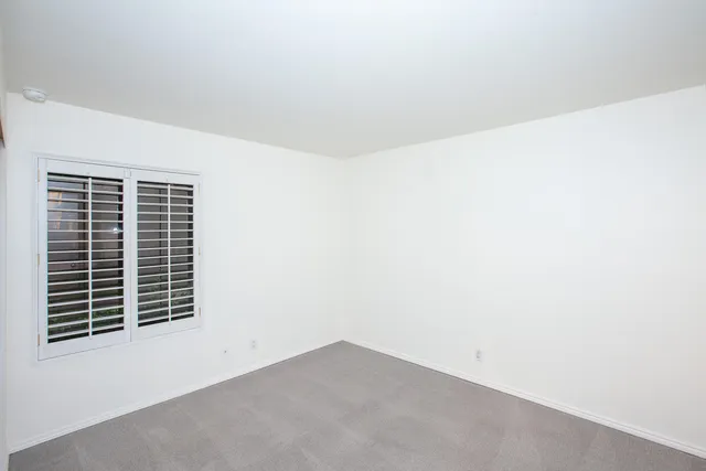a bathroom with a sink toilet a mirror and shower