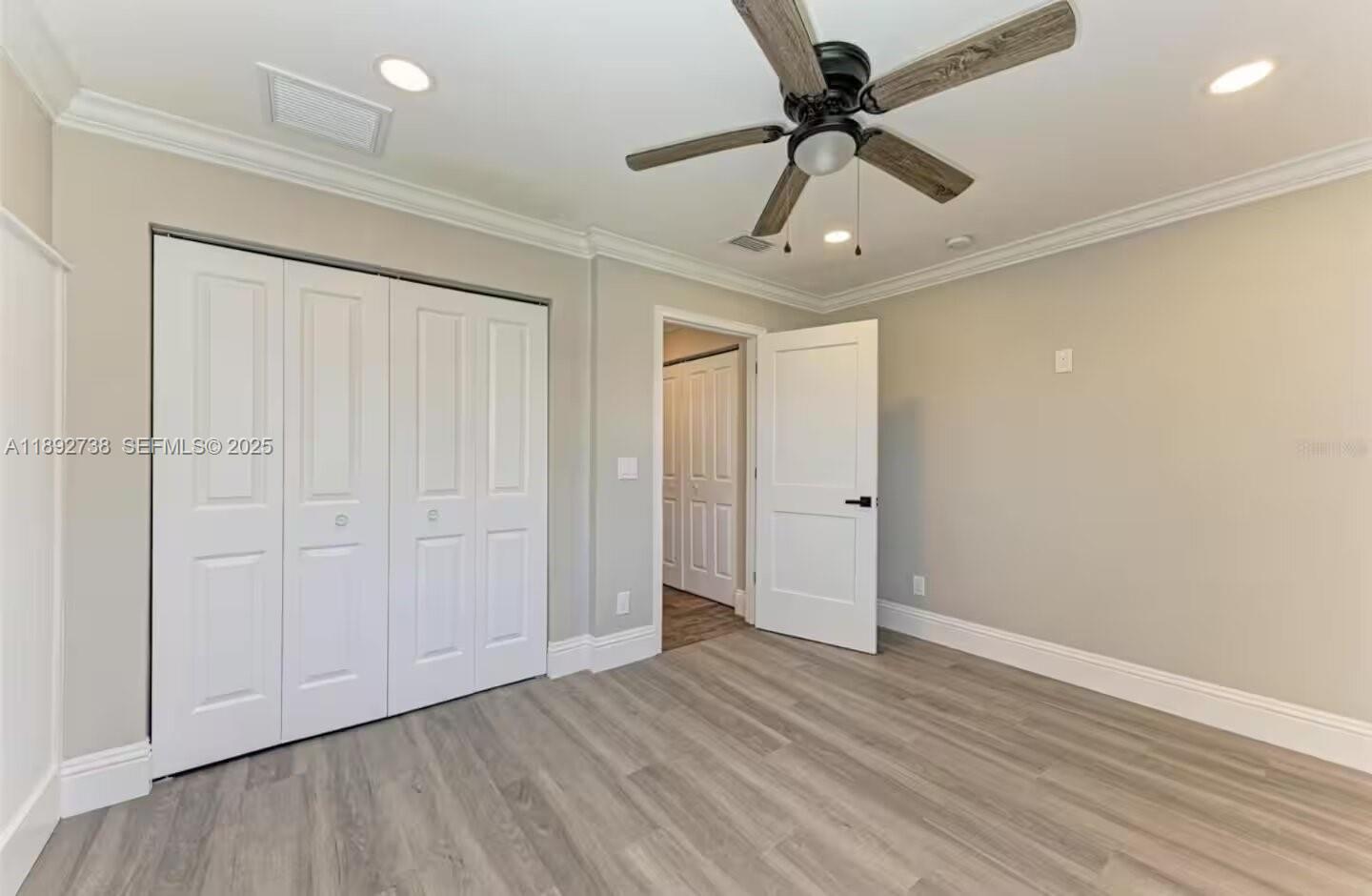 9675 Southwest Anchor, Unit 9674 Arcadia, FL 34269 - Photo 28 of 55 wooden floor in an empty room with a window
