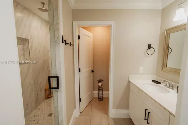 a bathroom with a toilet sink and a mirror