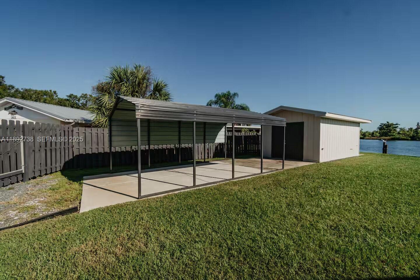 9675 Southwest Anchor, Unit 9674 Arcadia, FL 34269 - Photo 39 of 55 a view of backyard with a garden and deck