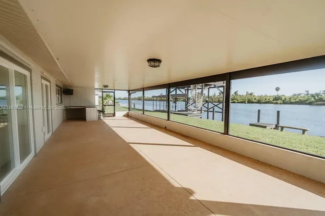 a view of a swimming pool with a lake view and mountain view