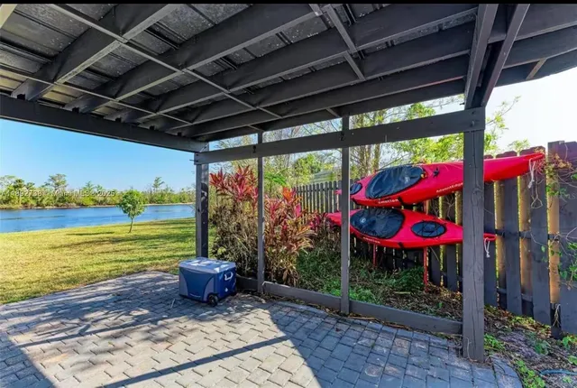 a view of a balcony with lake view and wooden floor