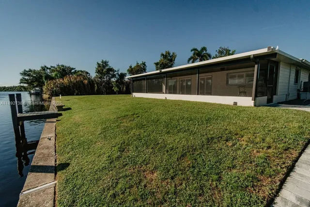 a view of a chairs and table in patio