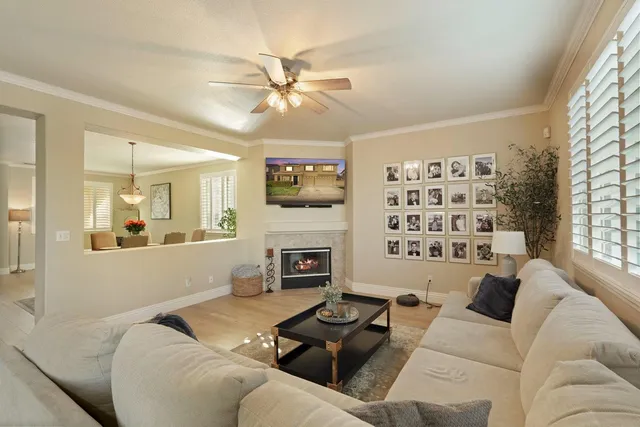 a view of a livingroom with workspace and a window
