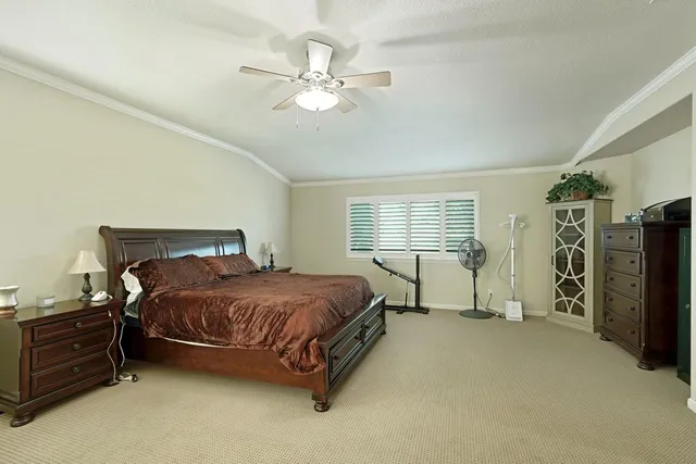 a front view of a house with swimming pool having outdoor seating