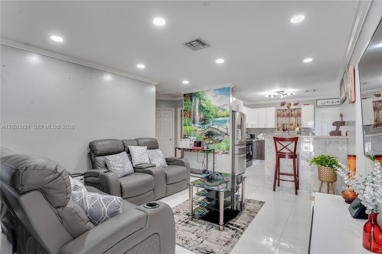 1360 Northwest 77th Street Miami, FL 33147 - Photo 5 of 41 a living room with furniture and a dining table with kitchen view