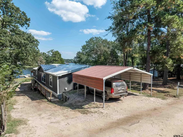 a living room with furniture a couch and a chandelier