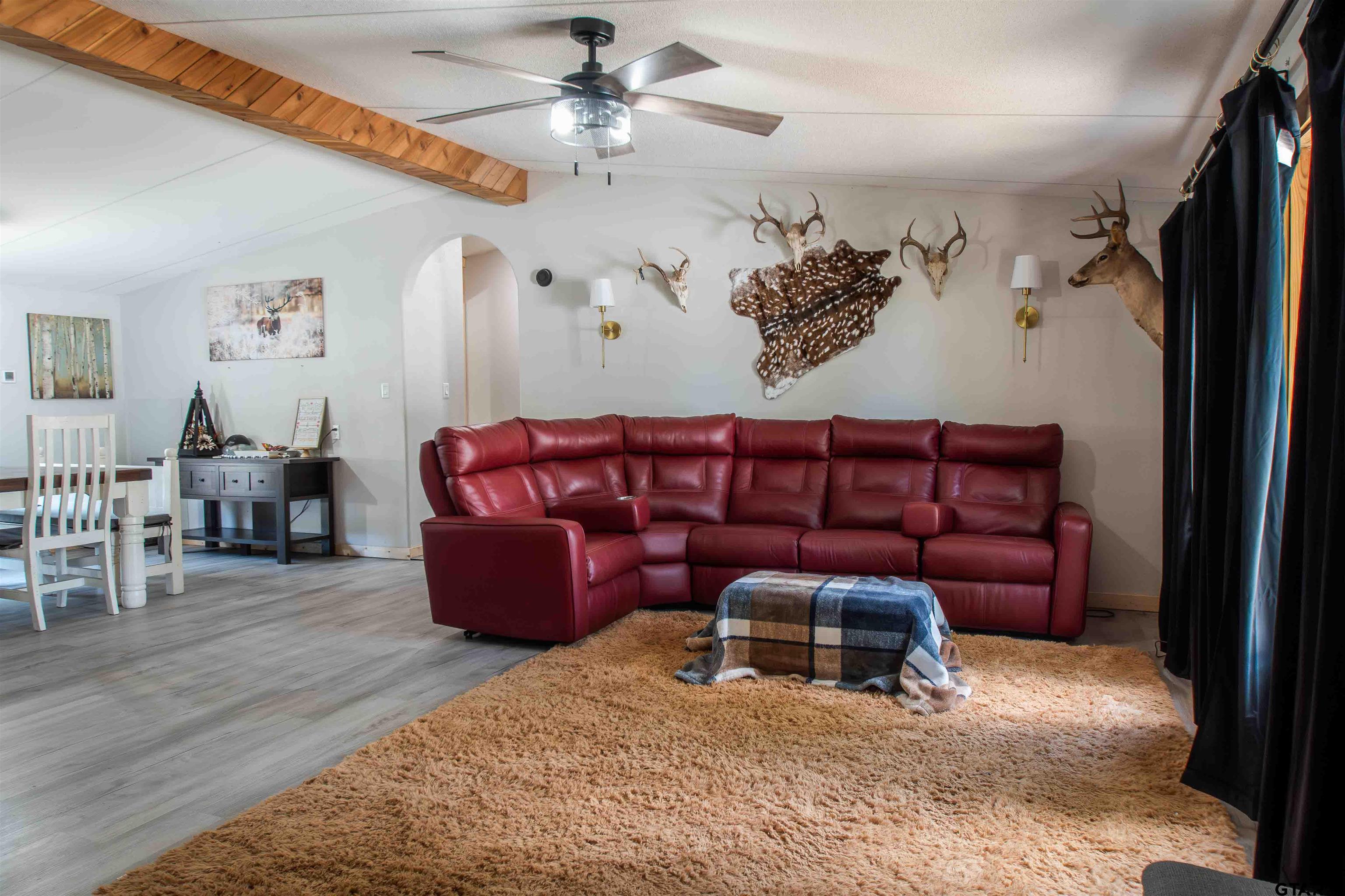 682 Dogwood Trail Murchison, TX 75778 - Photo 13 of 48 a living room with furniture a couch and a chandelier
