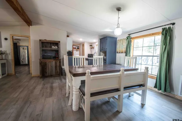 a kitchen with a sink stove and refrigerator