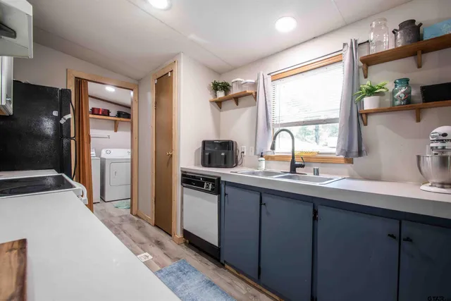 a kitchen with a sink and cabinets