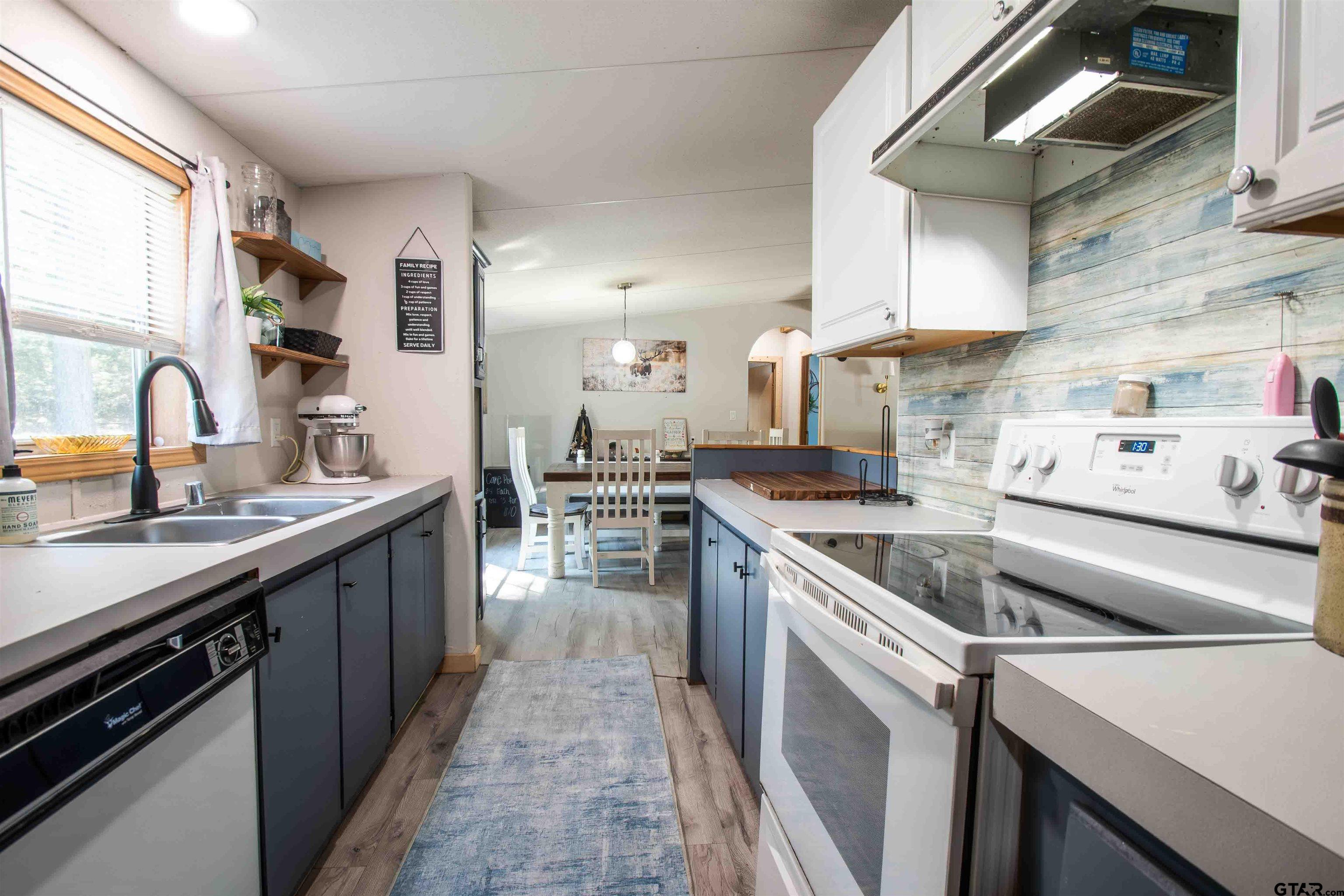 682 Dogwood Trail Murchison, TX 75778 - Photo 20 of 48 a kitchen with a sink and cabinets
