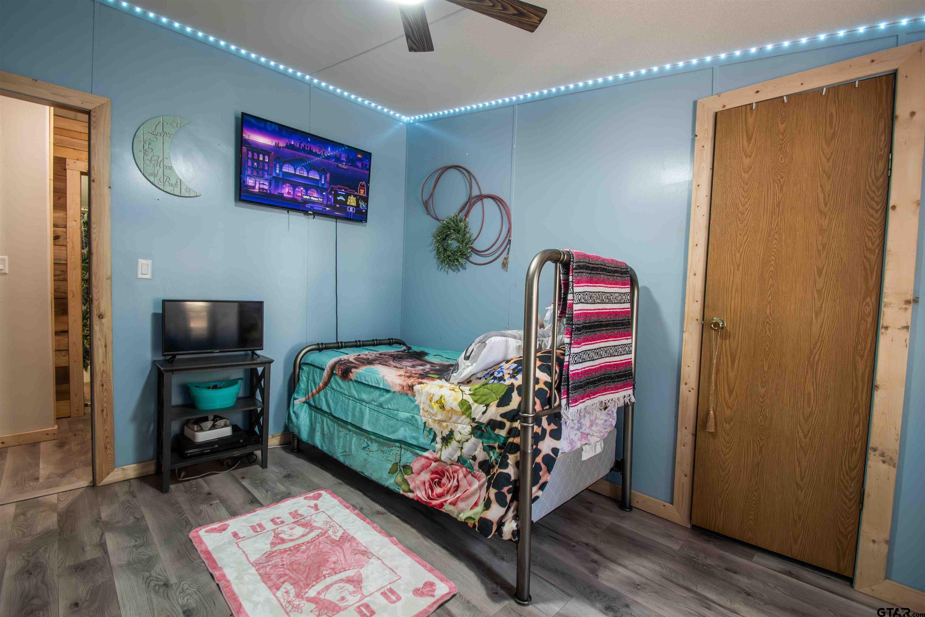 682 Dogwood Trail Murchison, TX 75778 - Photo 23 of 48 a bedroom with a bed and a dresser