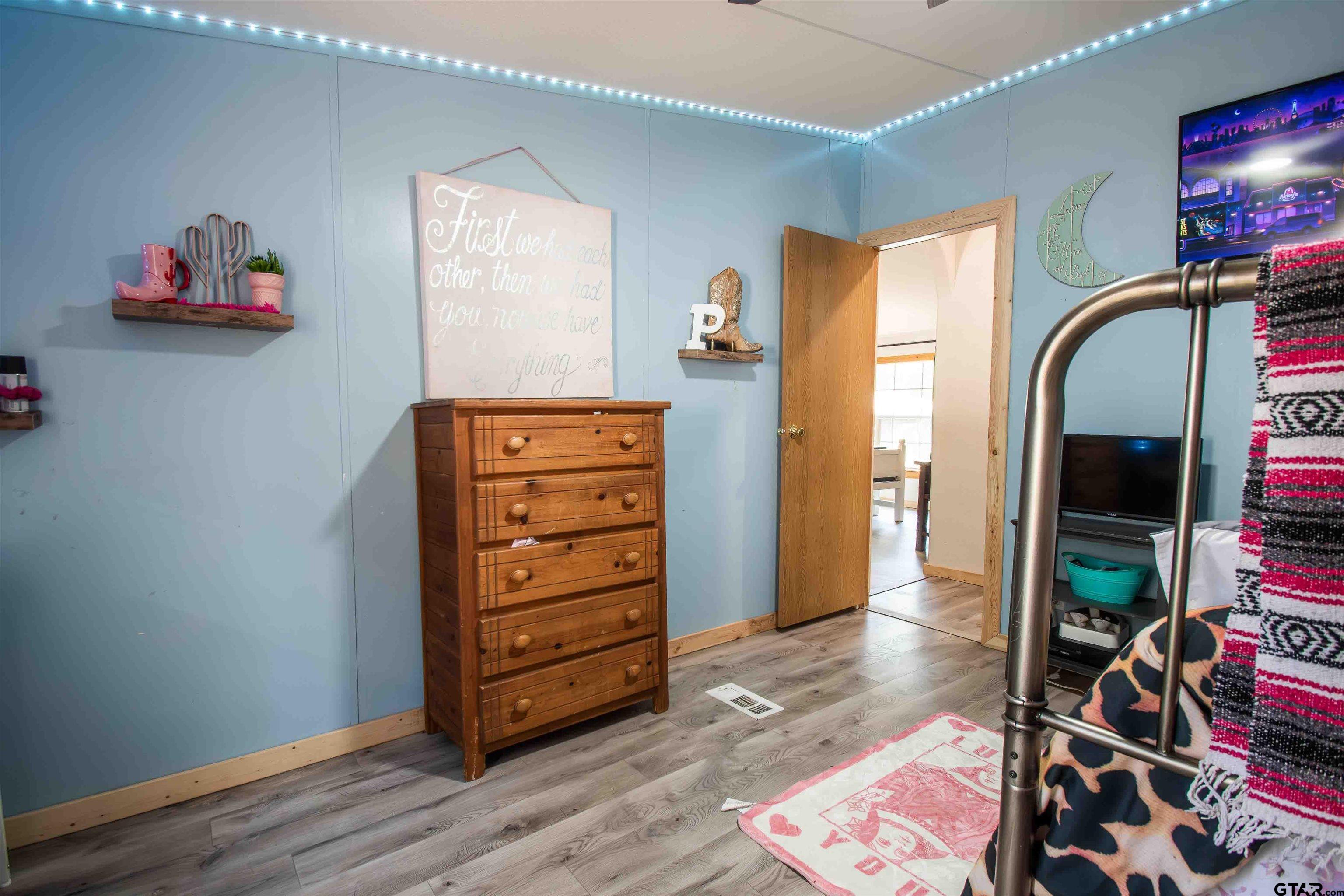 682 Dogwood Trail Murchison, TX 75778 - Photo 24 of 48 an empty room with closet and a mirror