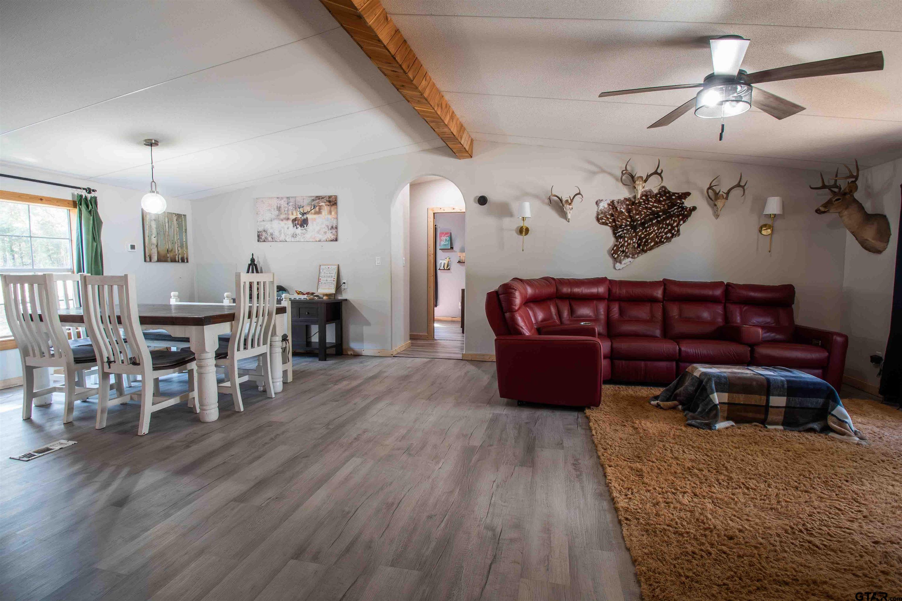 682 Dogwood Trail Murchison, TX 75778 - Photo 31 of 48 a living room with furniture and wooden floor