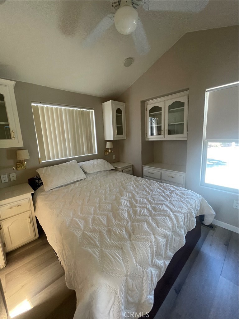 74711 Dillon Road, Unit 69 Desert Hot Springs, CA 92241 - Photo 4 of 18 a bed sitting in a bedroom next to a window