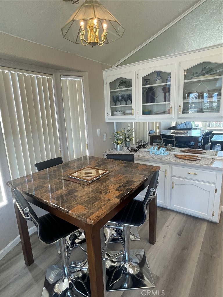 74711 Dillon Road, Unit 69 Desert Hot Springs, CA 92241 - Photo 8 of 18 a room with stainless steel appliances kitchen island granite countertop furniture and a kitchen view