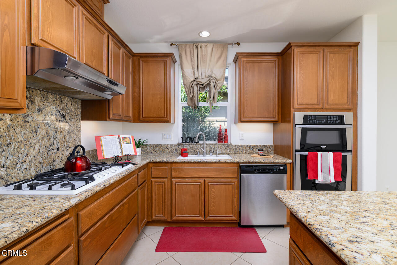 3716 E Park Camarillo, CA 93012 - Photo 11 of 29 a kitchen with stainless steel appliances granite countertop a sink stove and refrigerator