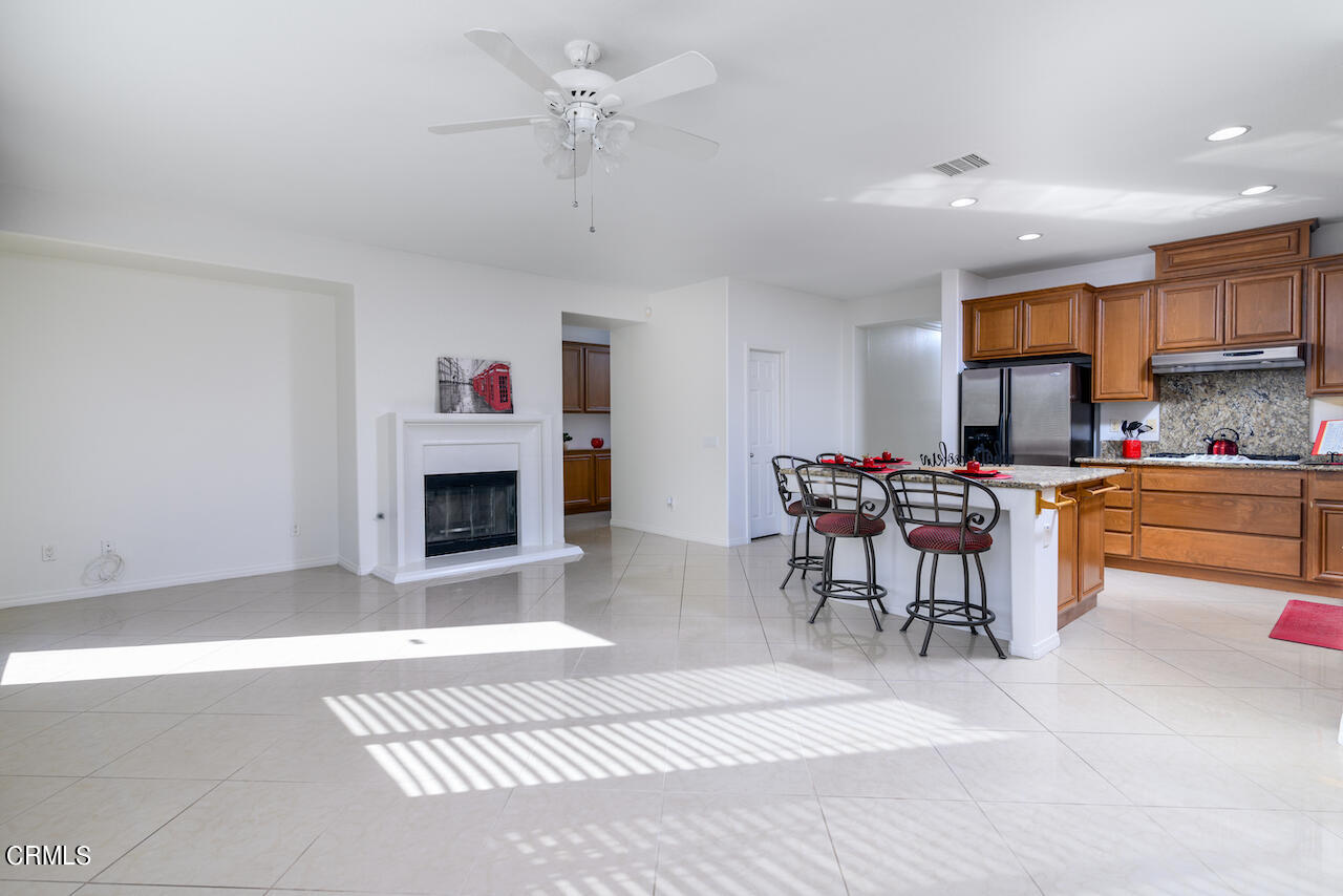 3716 E Park Camarillo, CA 93012 - Photo 13 of 29 a living room with furniture a fireplace and a table