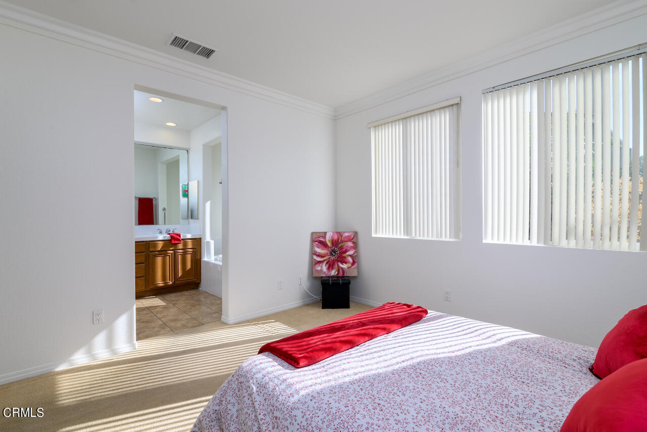 3716 E Park Camarillo, CA 93012 - Photo 14 of 29 a bedroom with a bed and a chandelier