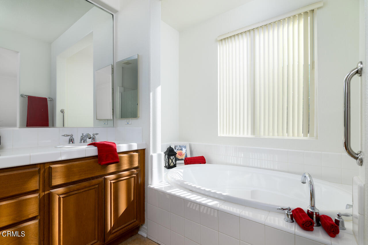 3716 E Park Camarillo, CA 93012 - Photo 19 of 29 a bathroom with a tub sink and a mirror