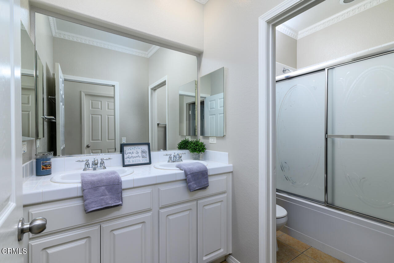 3716 E Park Camarillo, CA 93012 - Photo 23 of 29 a bathroom with a double vanity sink and a mirror