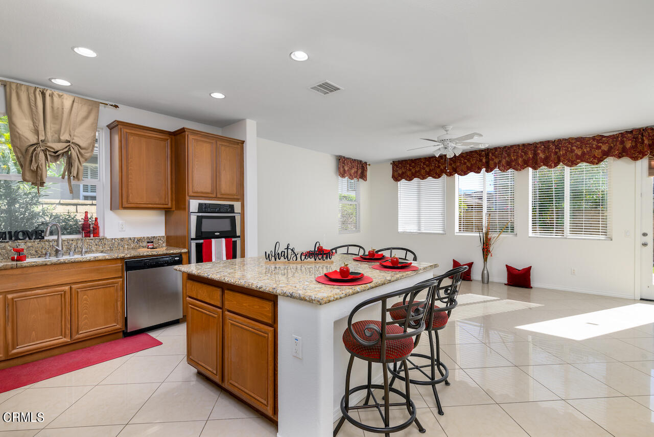3716 E Park Camarillo, CA 93012 - Photo 8 of 29 a kitchen with a stove a sink and a refrigerator