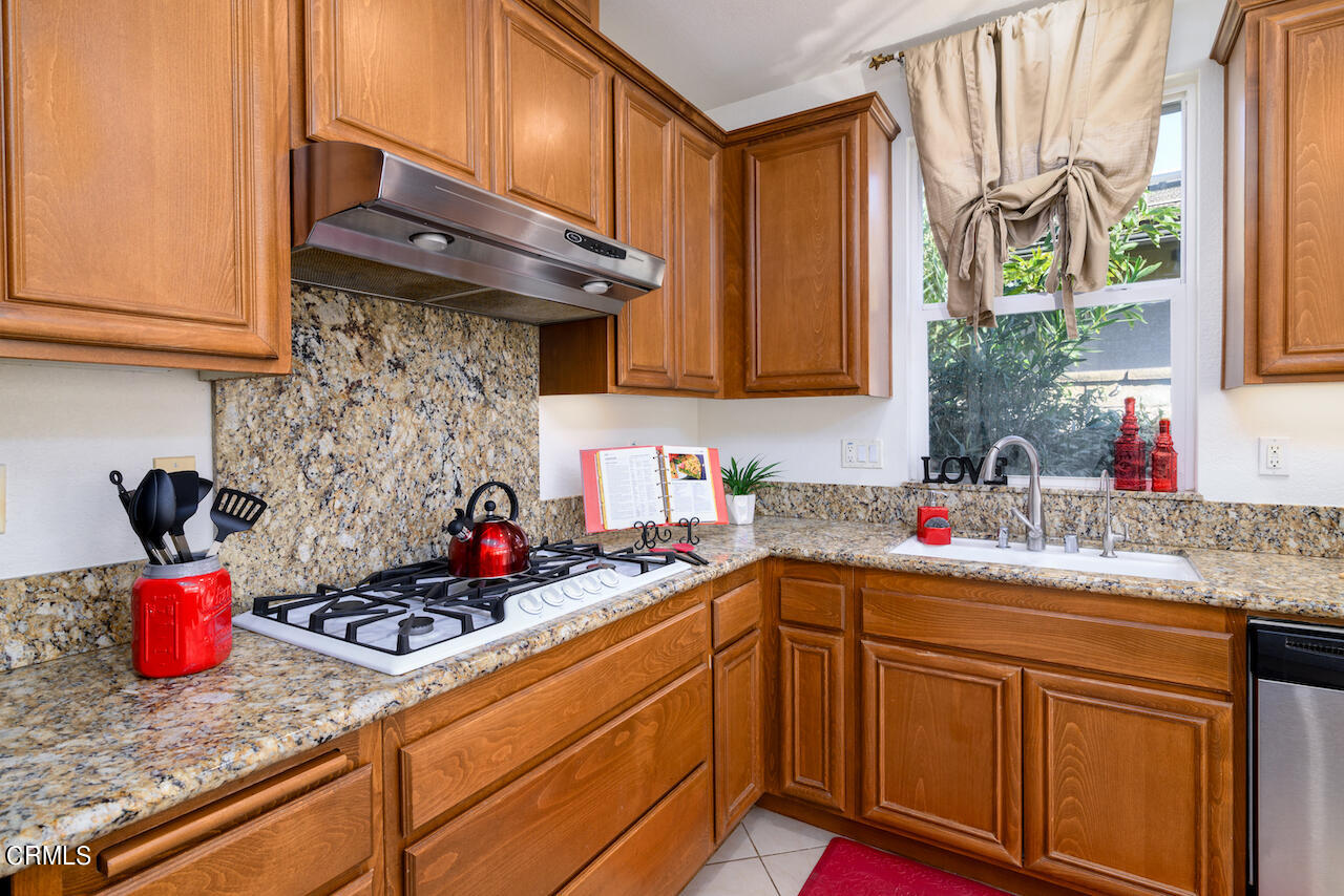 3716 E Park Camarillo, CA 93012 - Photo 10 of 29 a kitchen with stainless steel appliances granite countertop a sink stove and cabinets