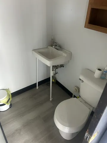 a bathroom with a toilet and a sink