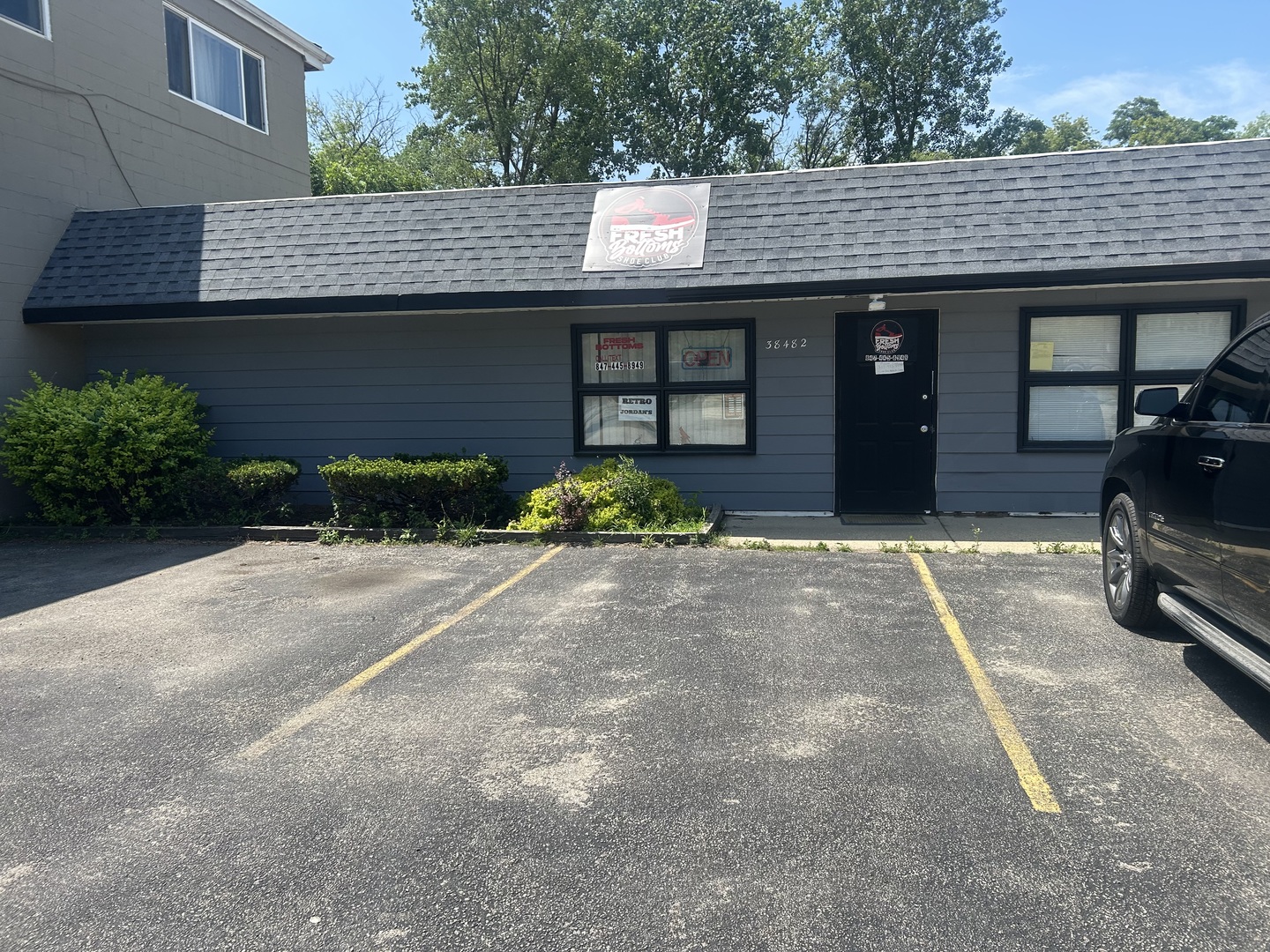 38488 North Sheridan Road Beach Park, IL 60087 - Photo 6 of 14 a front view of a house with a yard and garage