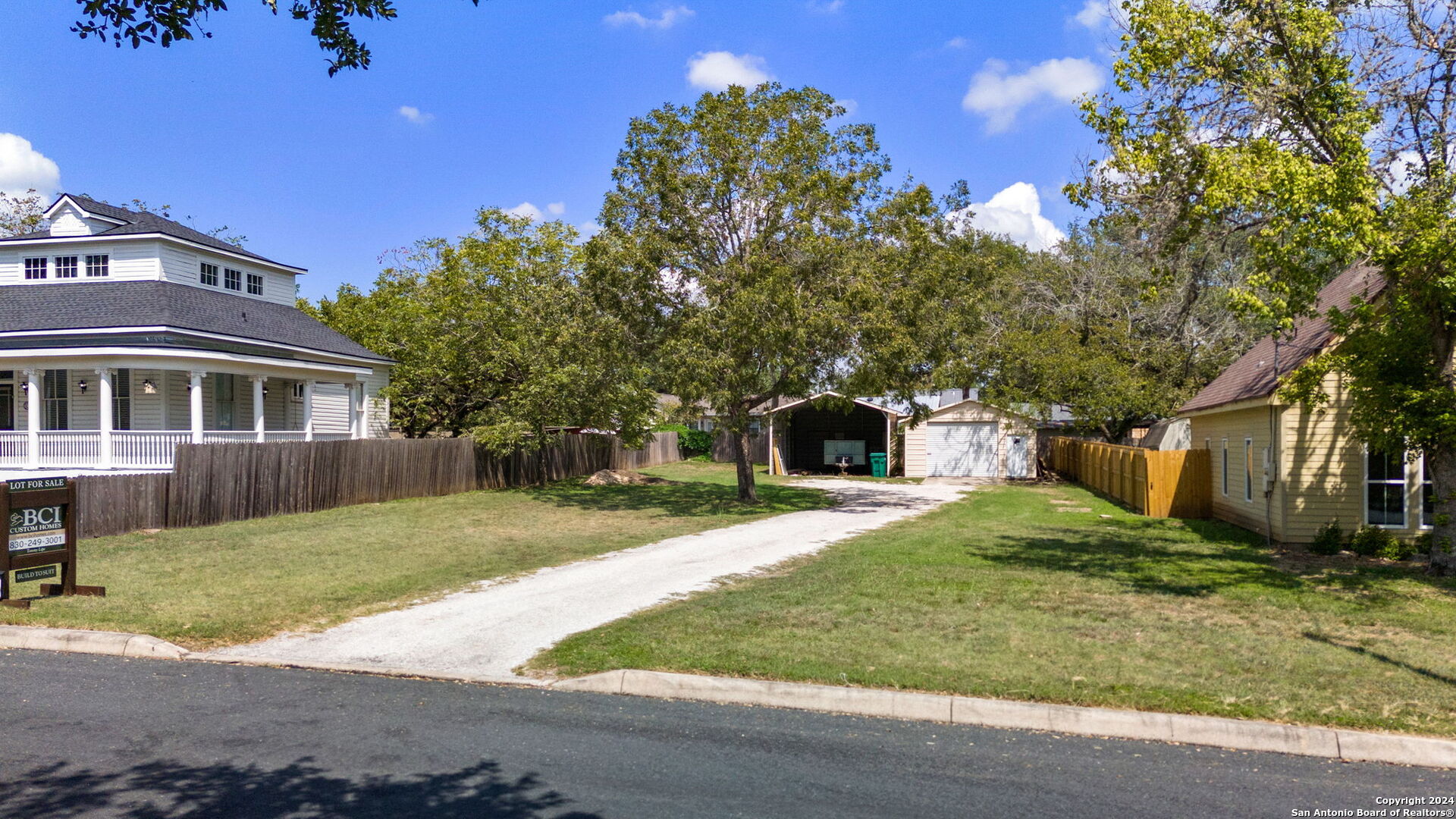 410 East Bandera Road Boerne, TX 78006 - Photo 3 of 17 a front view of a house with a yard and garage