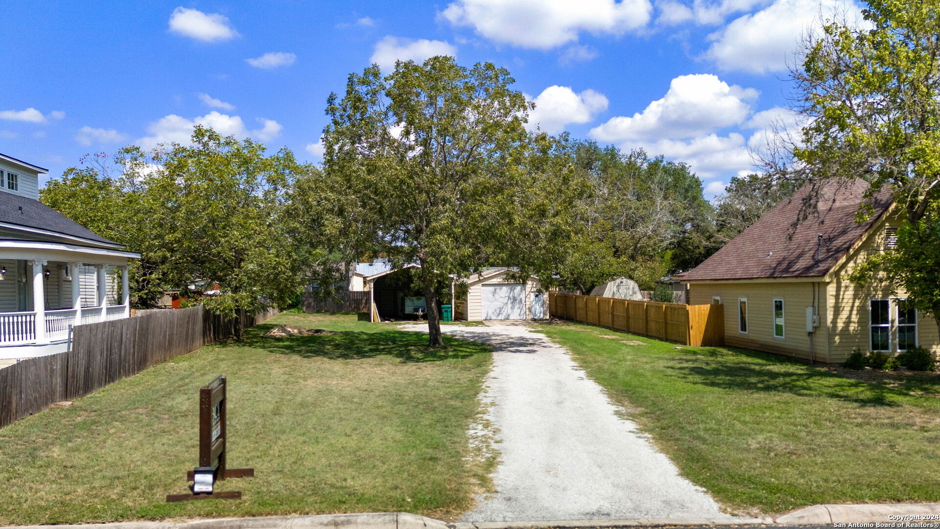 410 East Bandera Road Boerne, TX 78006 - Photo 7 of 17 a front view of a house with a yard and trees