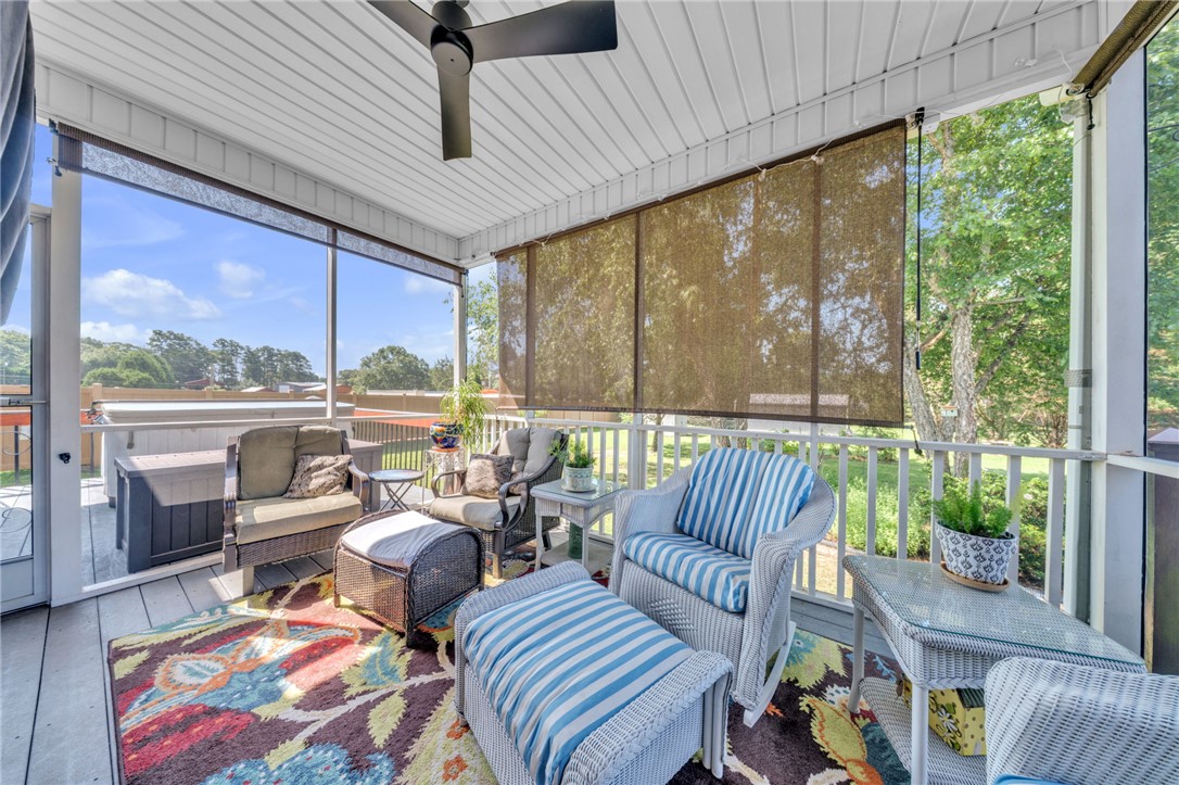 648 Mountain View Road Williamston, SC 29697 - Photo 29 of 42 Relax in comfort on this spacious, screened porch, offering serene views and ample outdoor living.