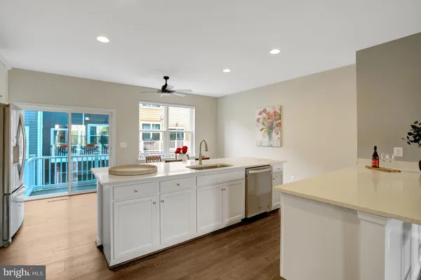 a kitchen with a sink and a stove top oven