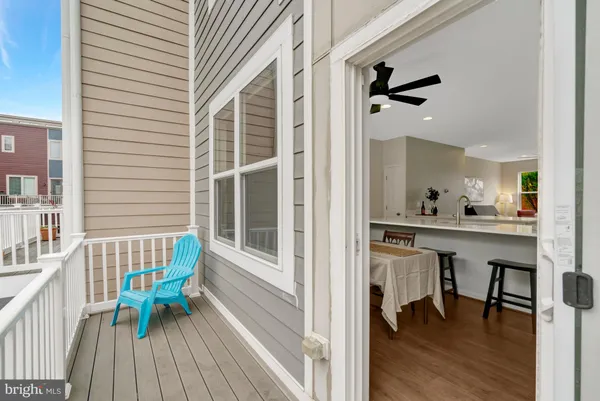 a view of a chair and table in the balcony