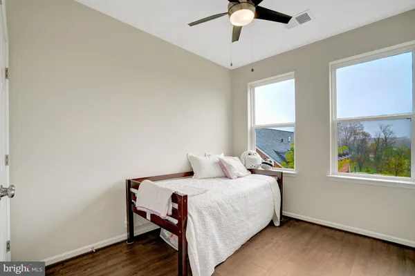 a bedroom with a bed and a dresser