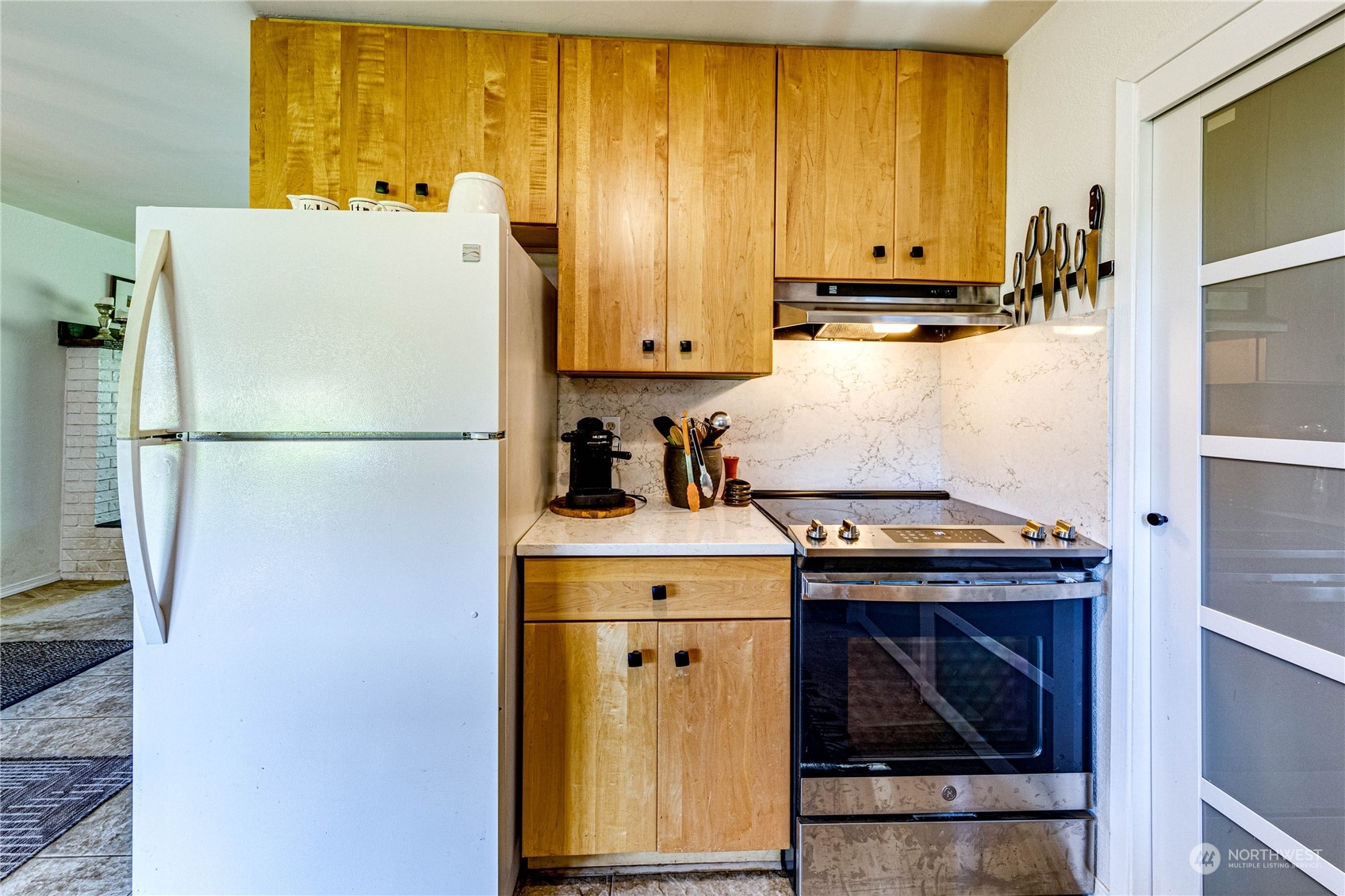 283 Schmitt Road Port Angeles, WA 98363 - Photo 11 of 40 a white refrigerator freezer and a stove sitting inside of a kitchen
