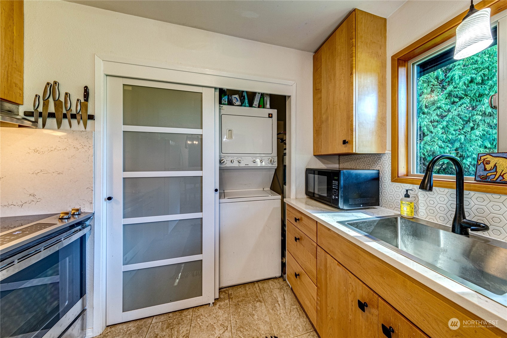 283 Schmitt Road Port Angeles, WA 98363 - Photo 13 of 40 a kitchen with a sink and a refrigerator