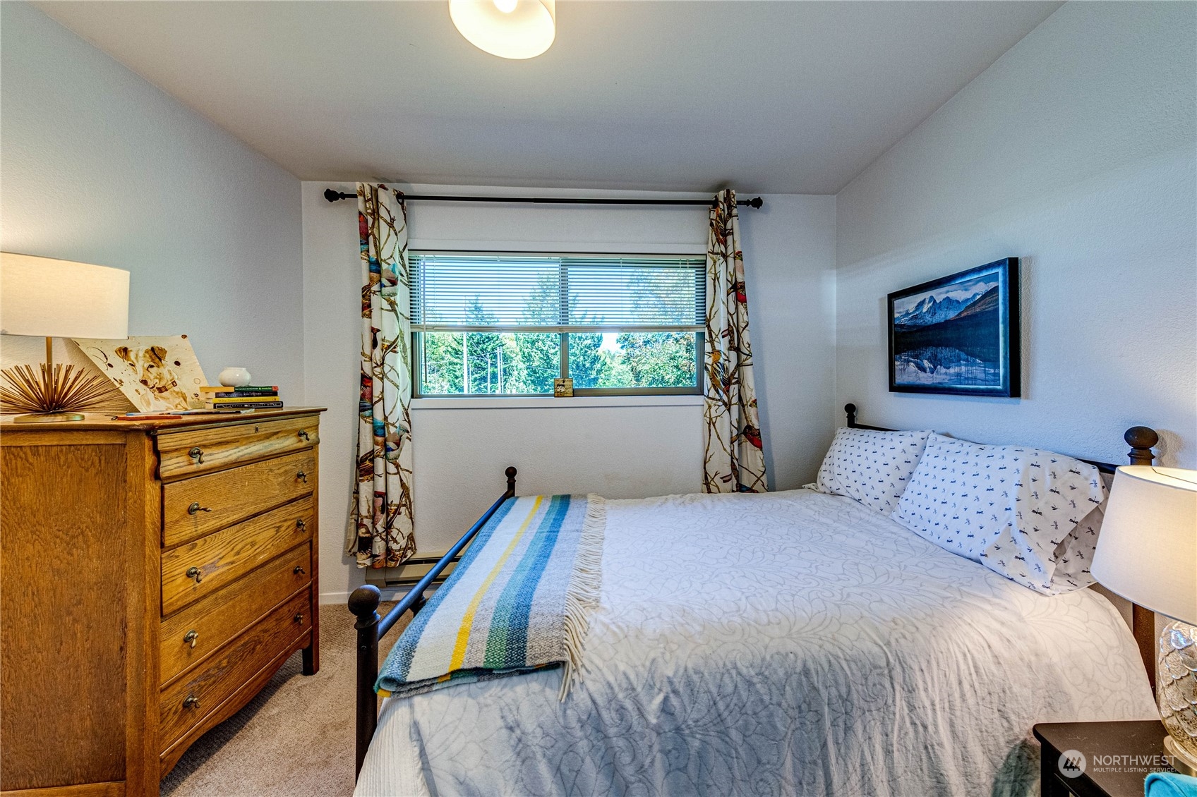 283 Schmitt Road Port Angeles, WA 98363 - Photo 16 of 40 a bedroom with a bed and a window