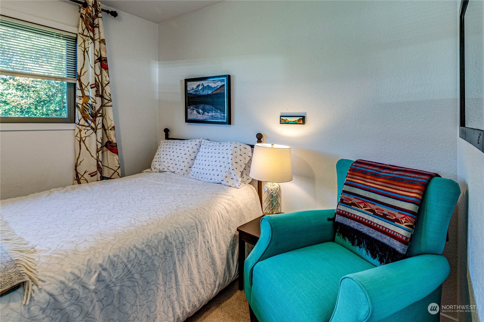 283 Schmitt Road Port Angeles, WA 98363 - Photo 17 of 40 a bedroom with a bed and a dresser