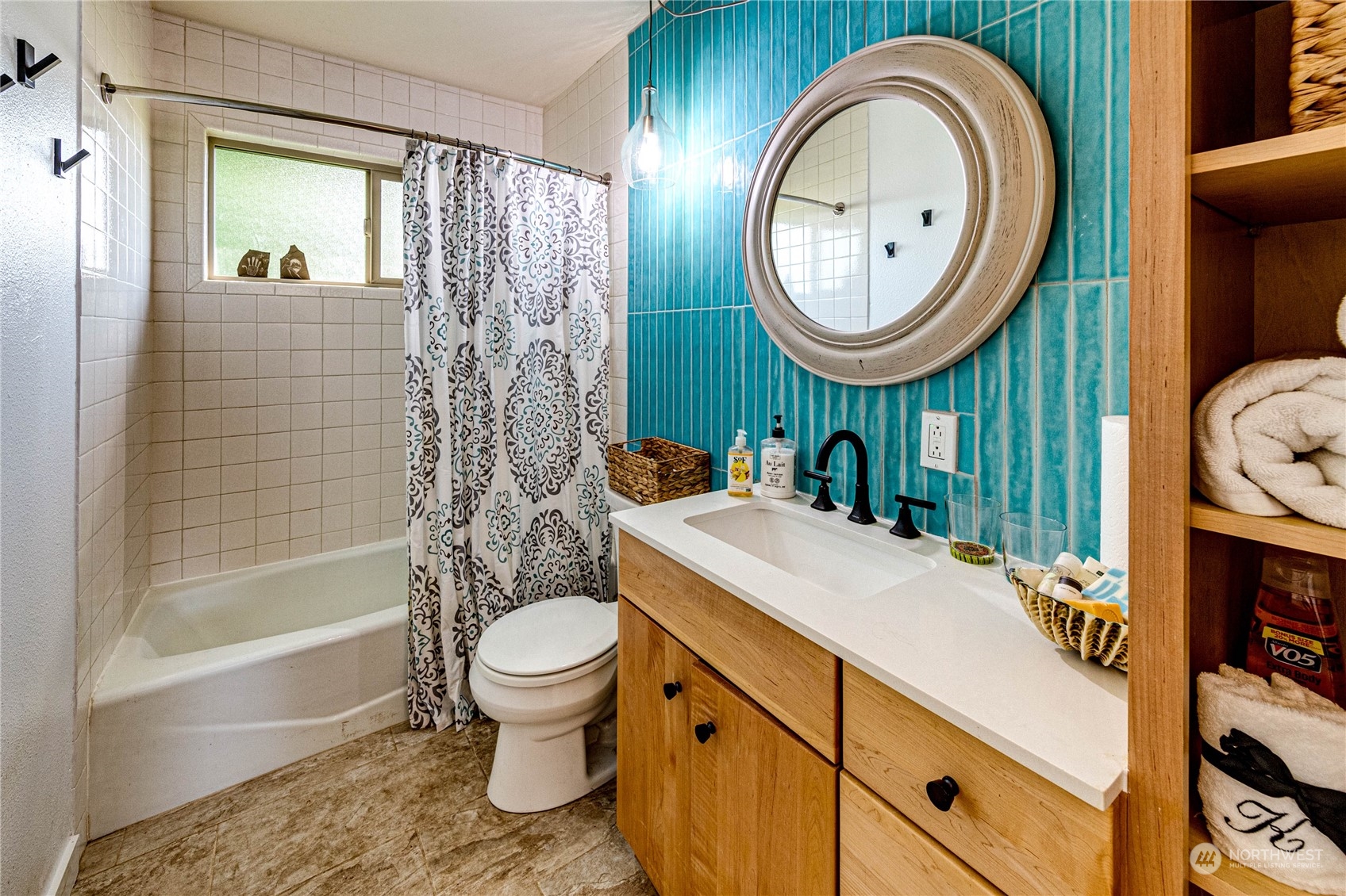 283 Schmitt Road Port Angeles, WA 98363 - Photo 18 of 40 a bathroom with a sink a toilet and a mirror