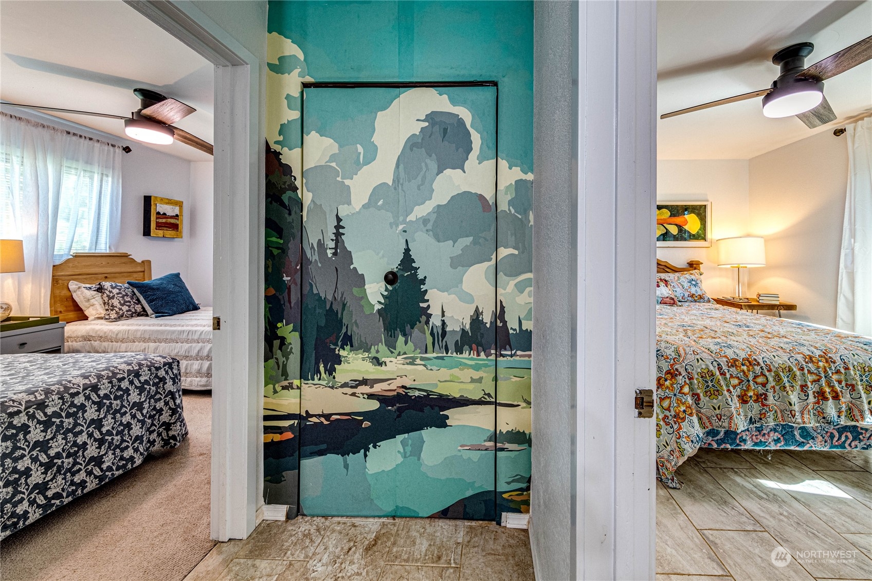 283 Schmitt Road Port Angeles, WA 98363 - Photo 19 of 40 a bedroom with a bed and a painting on the wall