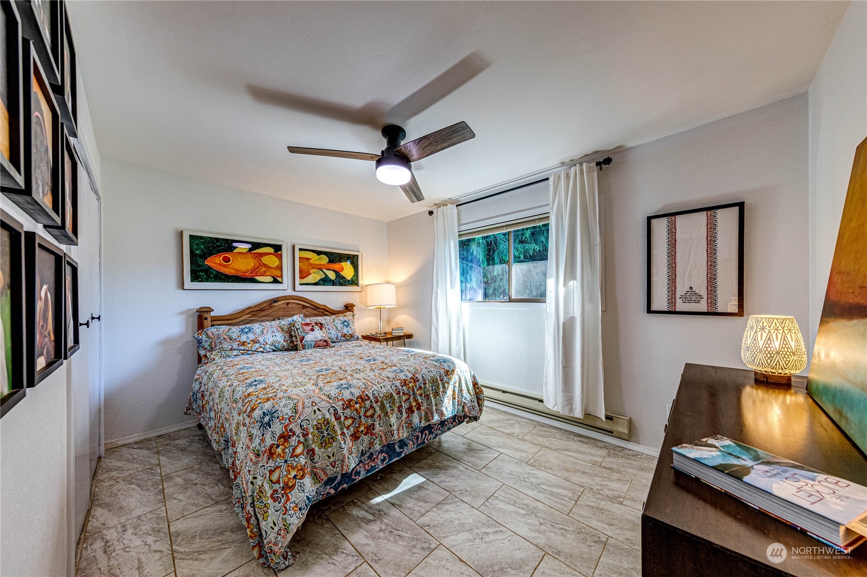 283 Schmitt Road Port Angeles, WA 98363 - Photo 21 of 40 a bedroom with a bed and a flat screen tv