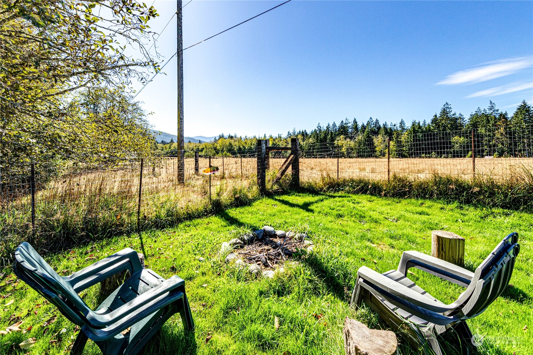283 Schmitt Road Port Angeles, WA 98363 - Photo 28 of 40 a view of a chairs and table in the garden