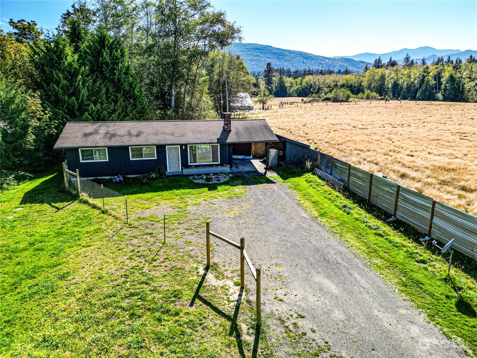 283 Schmitt Road Port Angeles, WA 98363 - Photo 35 of 40 an aerial view of a house with swimming pool and green space