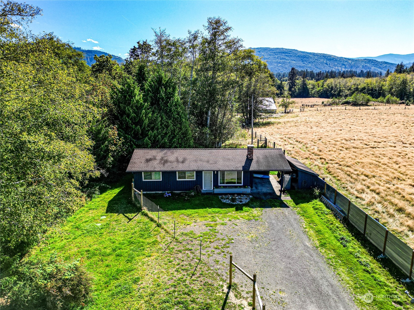 283 Schmitt Road Port Angeles, WA 98363 - Photo 36 of 40 a view of a terrace with a garden and trees