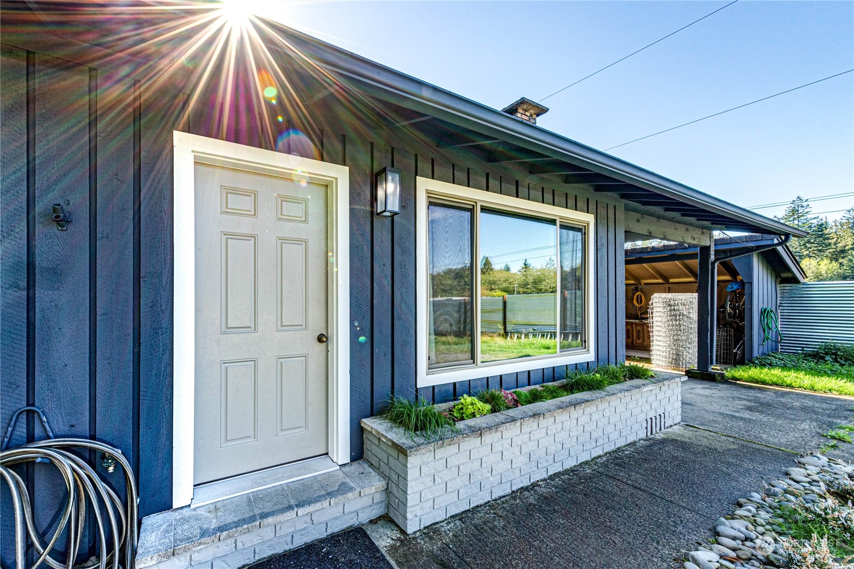 283 Schmitt Road Port Angeles, WA 98363 - Photo 5 of 40 a view of a house with porch and garden