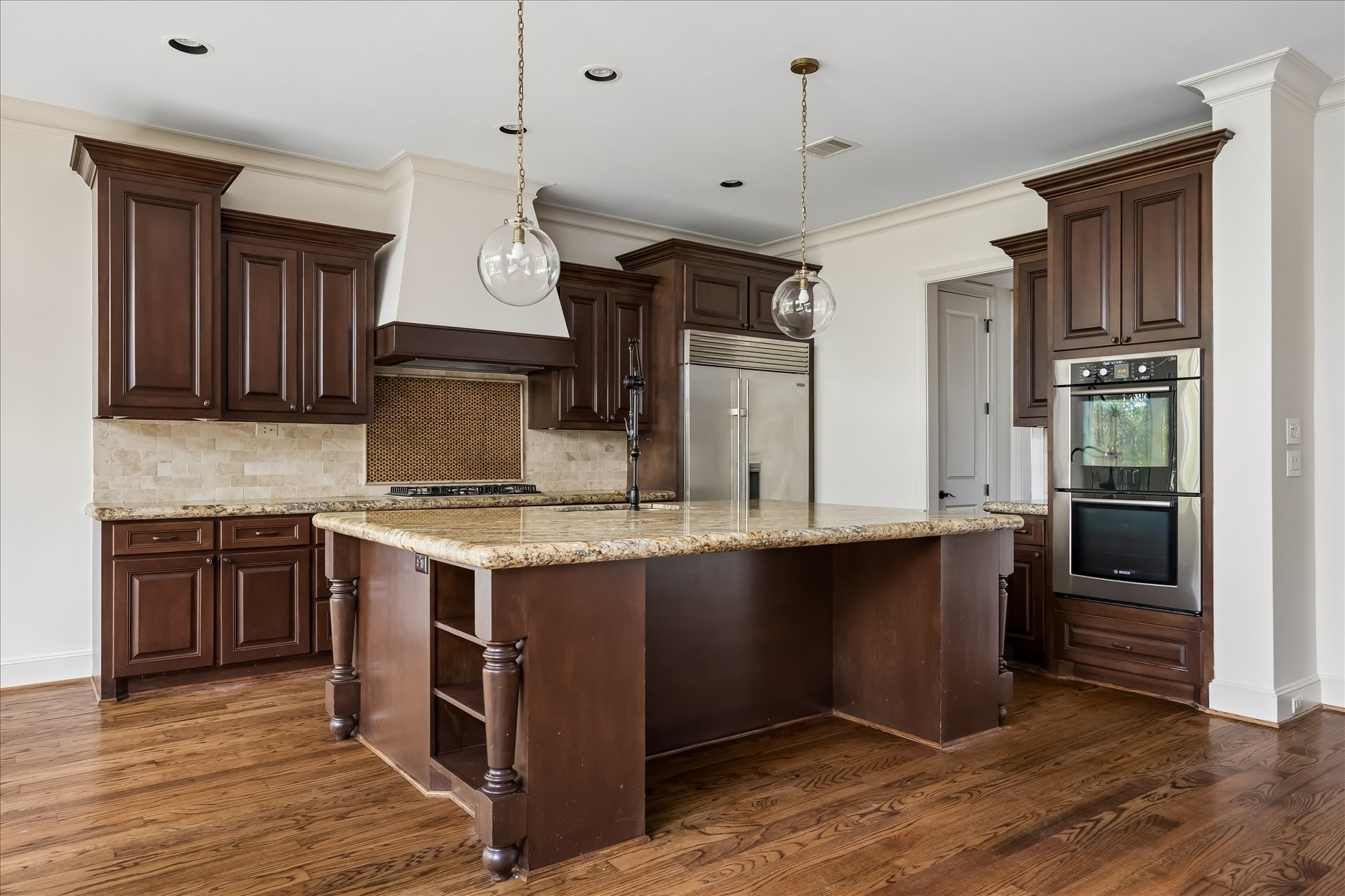 2246 Branard Street Houston, TX 77098 - Photo 13 of 40 Spacious kitchen centered around an oversized island designed for gathering, prep, and entertaining.