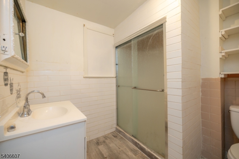 450 3rd Avenue, Unit 2 Elizabeth Port, NJ 07206 - Photo 8 of 23 a bathroom with a sink and mirror